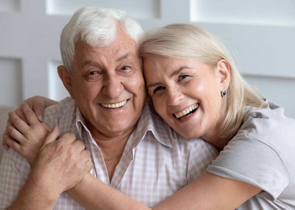 woman with her arms around a man